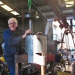 Bill assembling steam piston to air pump cylinder